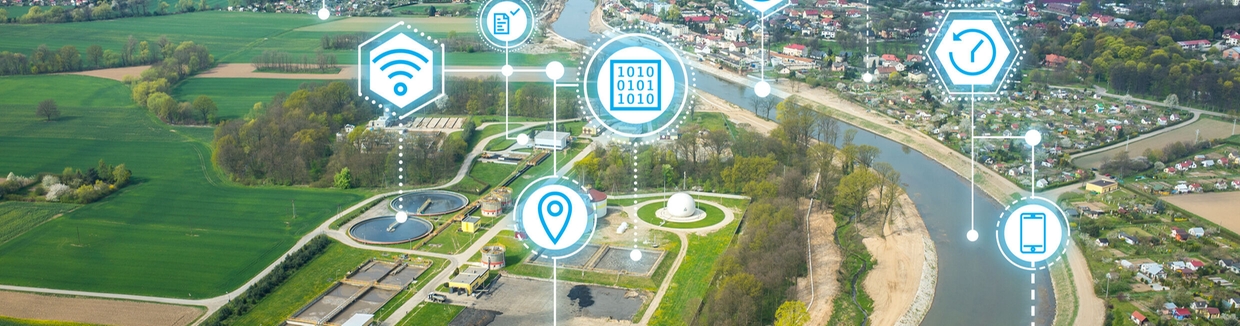 Painel do Netilion Network Insights em frente a um reservatório de água