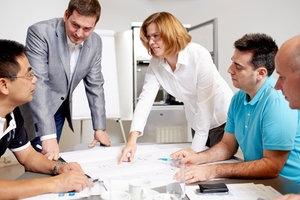 A group of project management experts in the planning phase